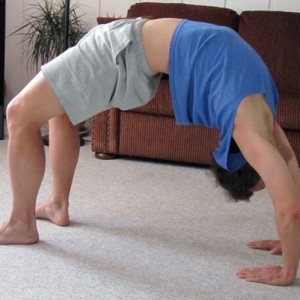 Freelance writer John Soares does his daily yoga back-bend: the wheel pose, chakrasana.